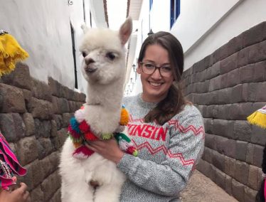 Katie Lorenz holding an alpaca