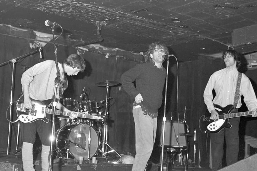 Black and white photo of R.E.M. performing at Merlyn's in 1981