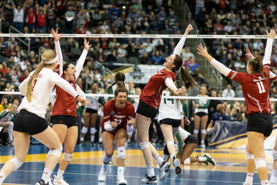 UW Women's volleyball team celebrates after scoring the winning point during the 2019 Baylor matchup