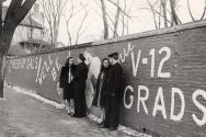 Cadets in the U.S. Navy's V-12 training program loiter by the Kiekhofer Wall in the 1940s. The wall was a social media platform for the pre-digital age.