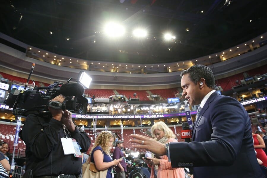 Manu Raju in front of news camera at the 2016 Democratic National Convention