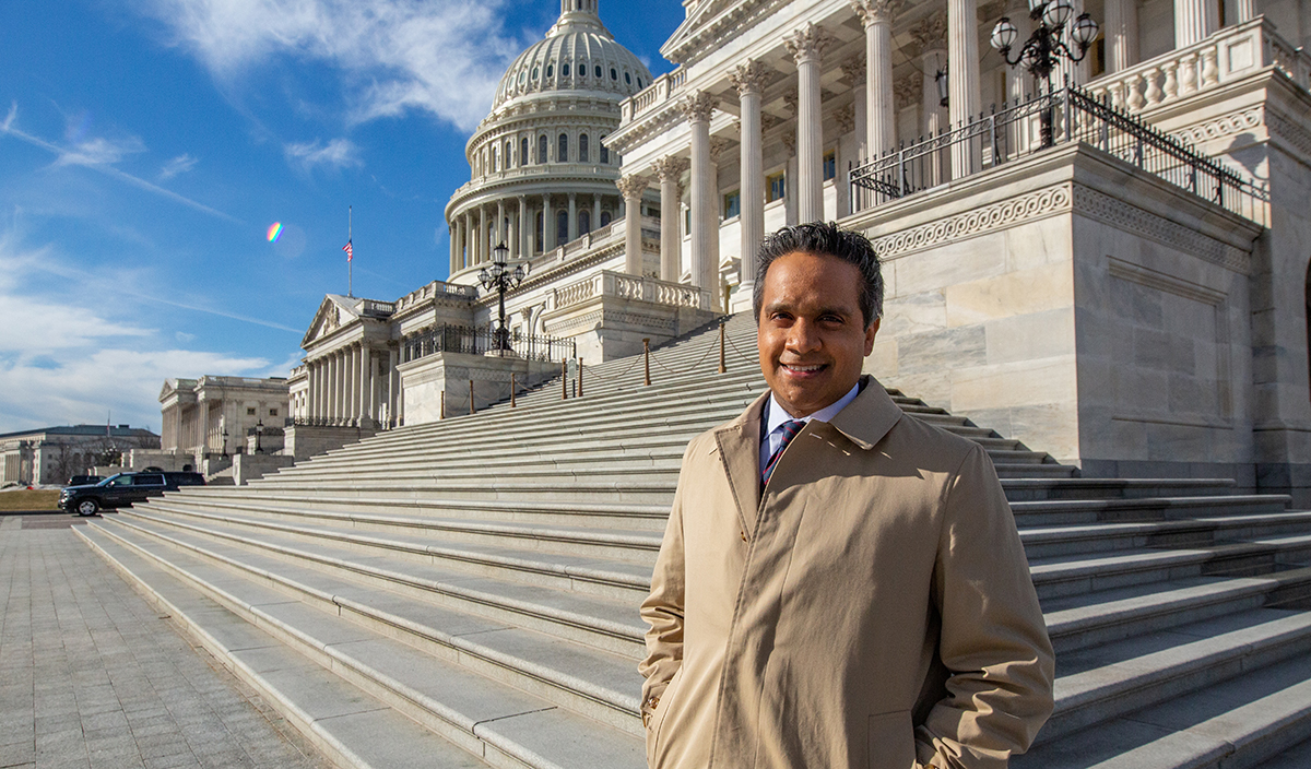 Manu Raju in front of the U.S. Capitol building