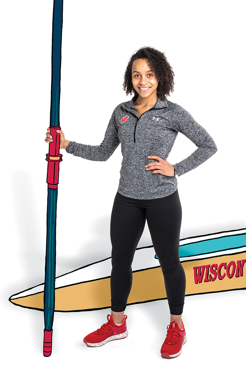 Tori Kost holding kayak oar