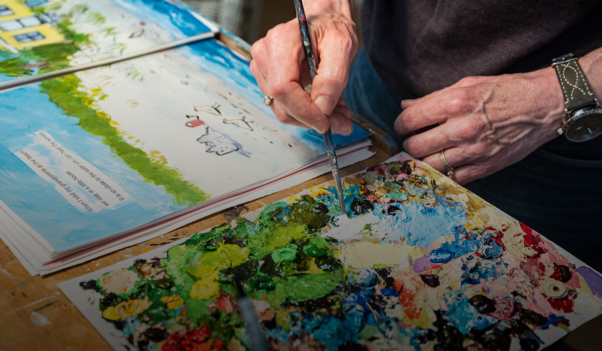 Close-up of Laura Dronzek's hands working on an illustration