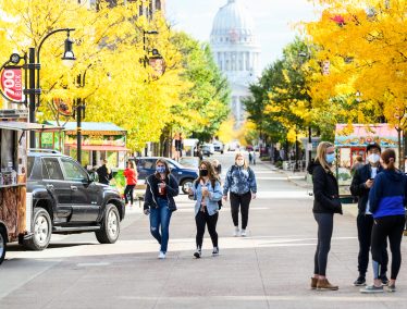 Pedestrians walk through Library Mall in the Autumn