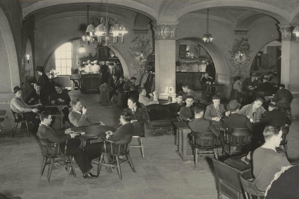 Black and white 1930s photo of male students sitting in the Rathskeller