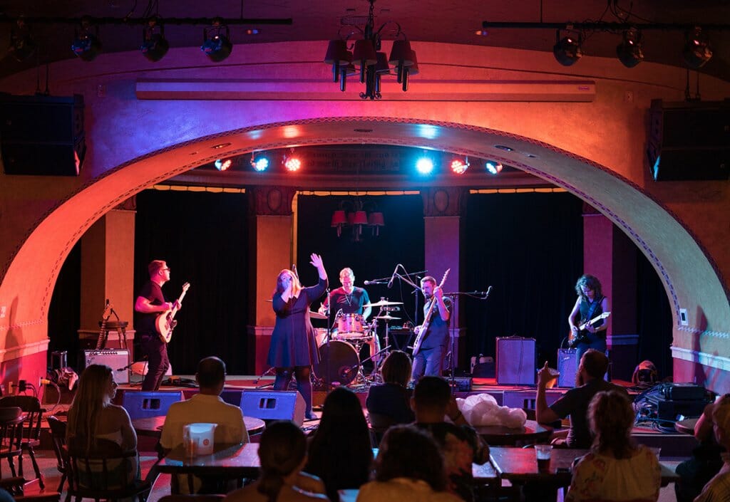 Band plays under colored stage lights at the Rathskeller