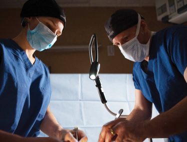 Two surgeons performing surgery using the MezLight