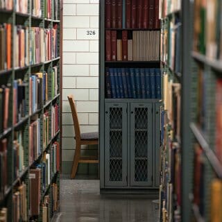 Photo of study alcove at the end of metal library book stacks
