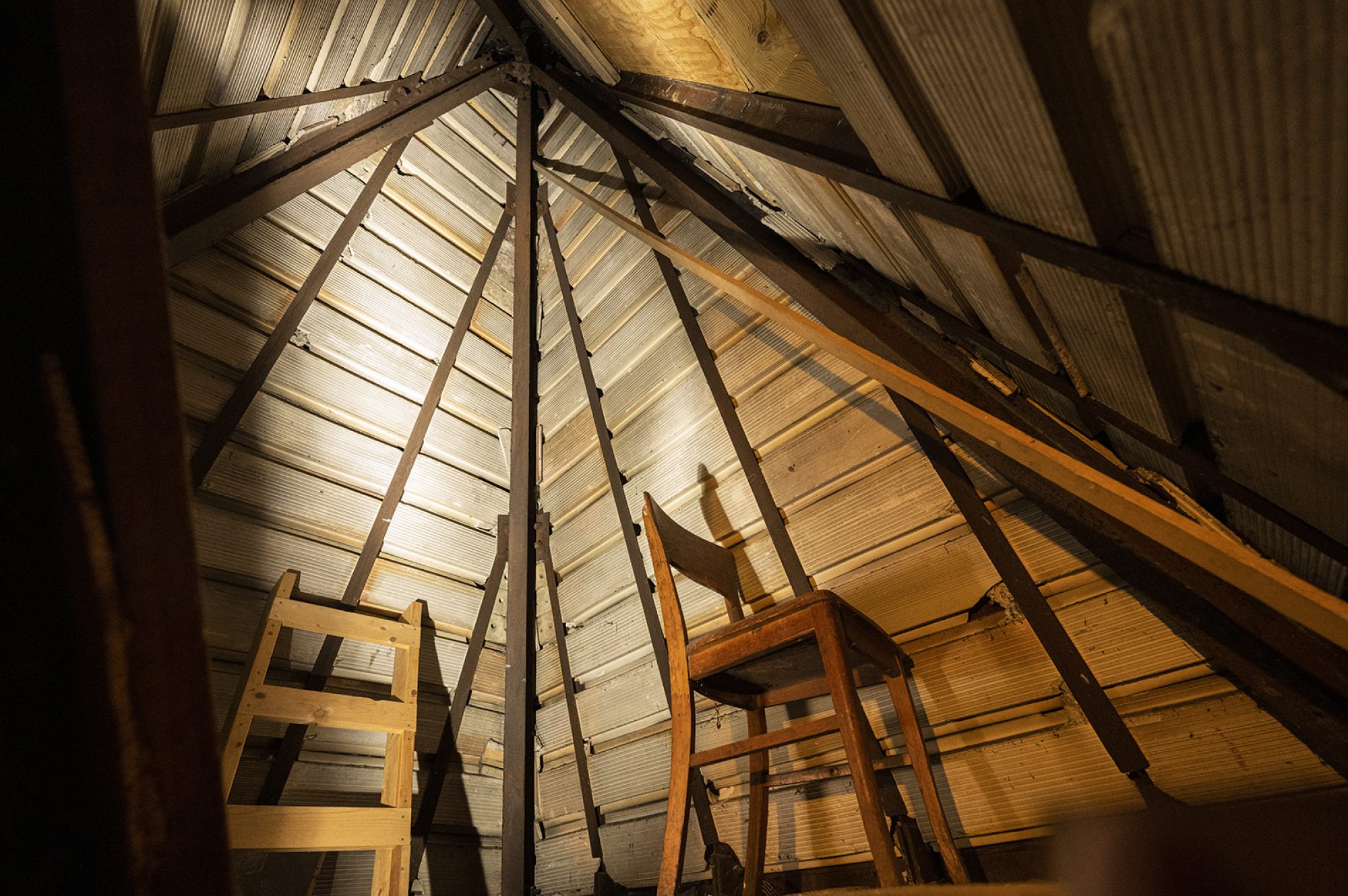 Upwards view of the wooden rafters in the Science Hall attic