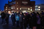 Members of the UW community gather together holding candles in support of Ukraine