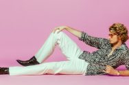 Matthew Hauri, as "Yung Gravy", poses against a pink background