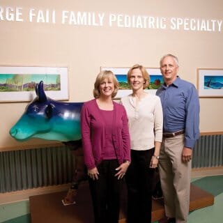 George Fait's three children, Leslie, Dian, and Joel pose at the American Family Children's Hospital