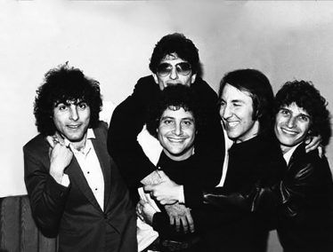 Black and white photo of Bruce with the band