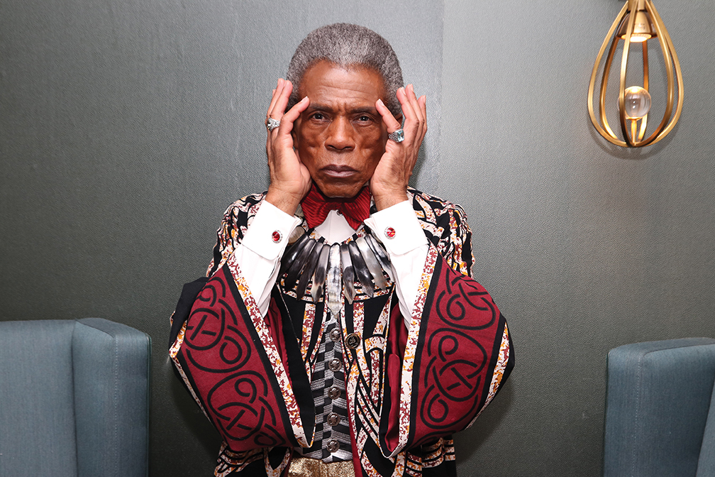 André De Shields wears a red robe in costume as Orpheus