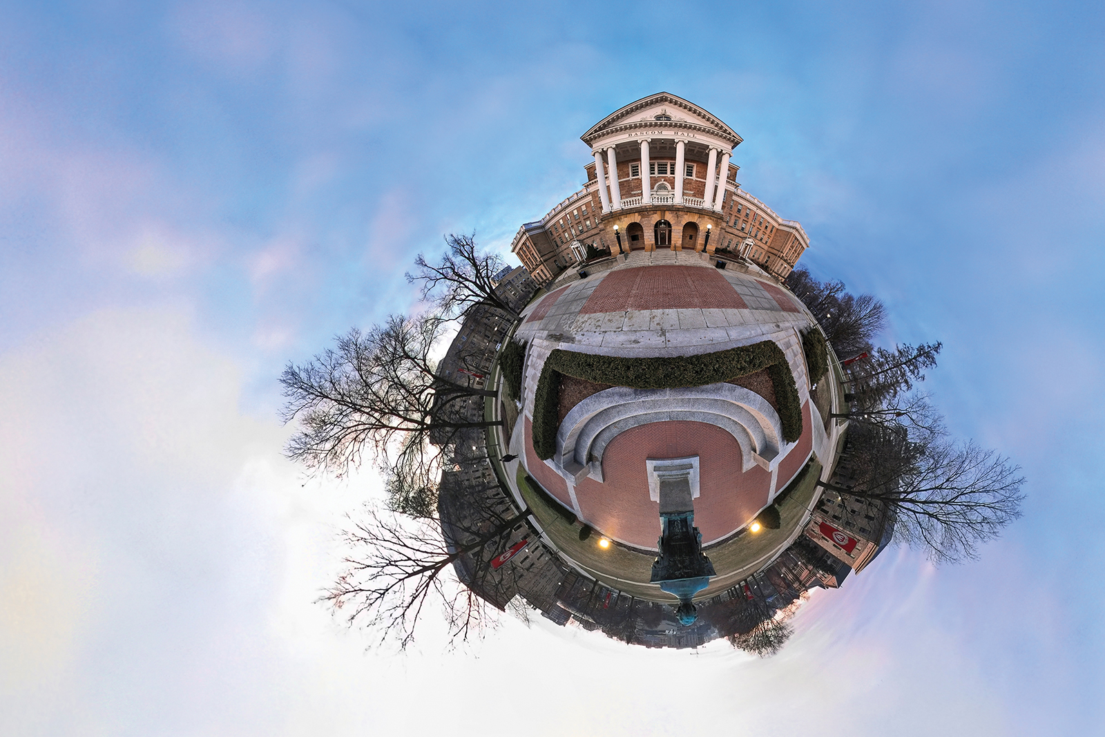 Three-sixty degree photograph of Bascom Hall against a dusky sky makes the scene appear round as though reflected off of a crystal ball
