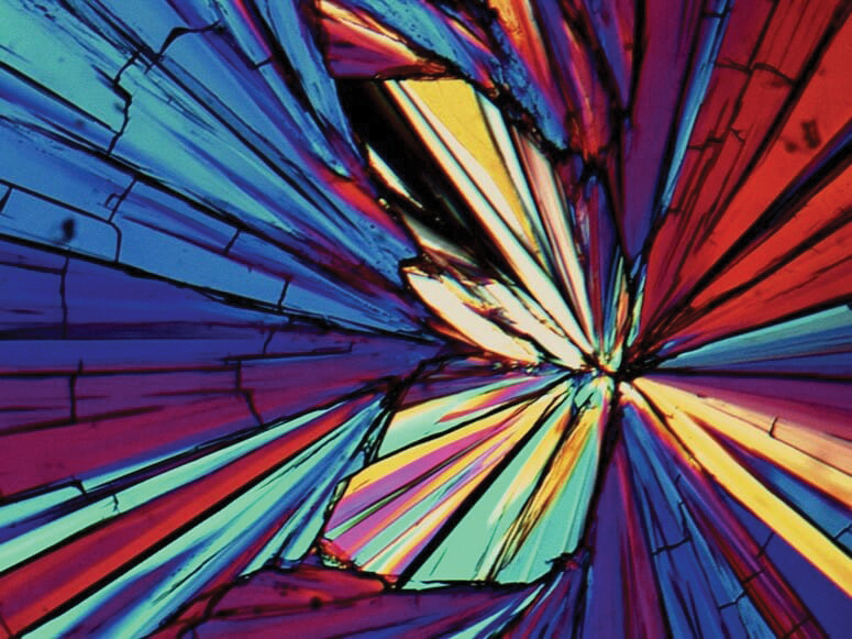Colorful abstract closeup of light refracting through crystals