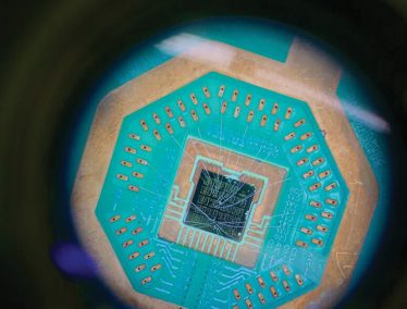 teal and dark blue rendering of a microchip