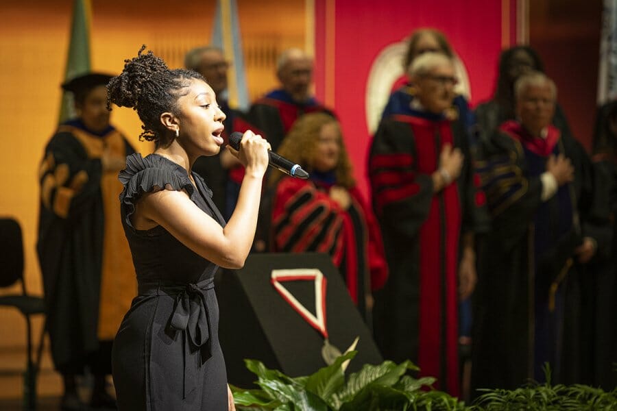 Student Jerzy Gillon sings the National Anthem before an Investiture Ceremony at the Hamel Music Center installing Chancellor Jennifer L. Mnookin as the 30th leader of the University of Wisconsin–Madison on April 14, 2023. The event is part of Investiture Week, a series of special campus events planned for April 10-15 to celebrate the university and formally welcome Mnookin as chancellor. (Photo by Bryce Richter / UW–Madison)