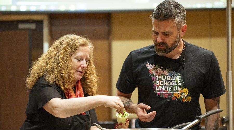 Placing filling into a samosa, Chancellor Jennifer Mnookin (left) takes part in a live cooking demonstration with UW alum and host of the Emmy Award-winning show Wisconsin Foodie, Chef Luke Zahm (right), hosted by the Wisconsin Union Directorate Cuisine Committee, which was held in Varsity Hall inside Union South at the University of Wisconsin–Madison during spring on April 12, 2023. They prepared and served fried samosas with an apple butter dipping sauce. The event is part of Investiture, a series of special campus events planned for April 3-15 to celebrate the university and formally welcome Jennifer L. Mnookin as chancellor and the 30th leader of the UW–Madison. (Photo by Bryce Richter / UW–Madison)