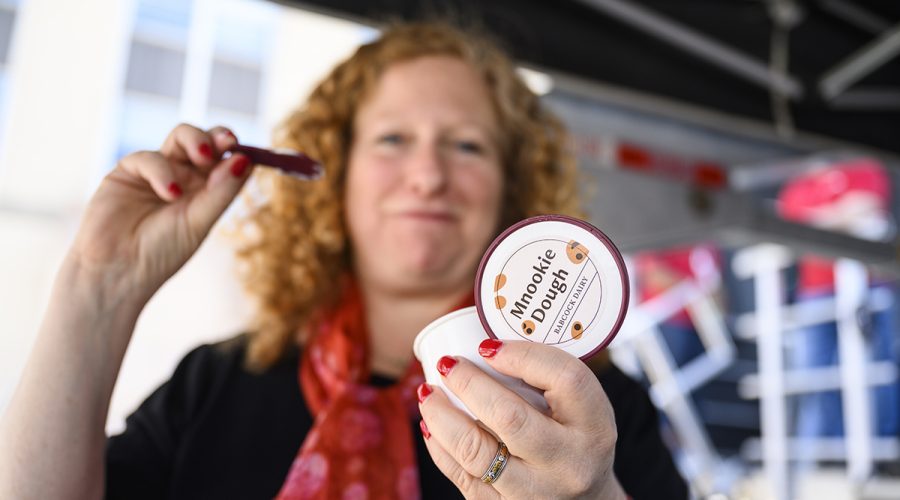 Chancellor Jennifer Mnookin tastes the new ice cream flavor (Mnookie Dough) for the first time during a post-Investiture ceremony picnic on Library Mall at the University of Wisconsin–Madison on April 14, 2023. The picnic included live music, entertainment, and free food. The event is part of Investiture Week, a series of special campus events planned for April 10-15 to celebrate the university and formally welcome Mnookin as chancellor. (Photo by Althea Dotzour / UW–Madison)