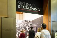 Visitors enter the Sifting and Reckoning exhibit at the Chazen Museum of Art.