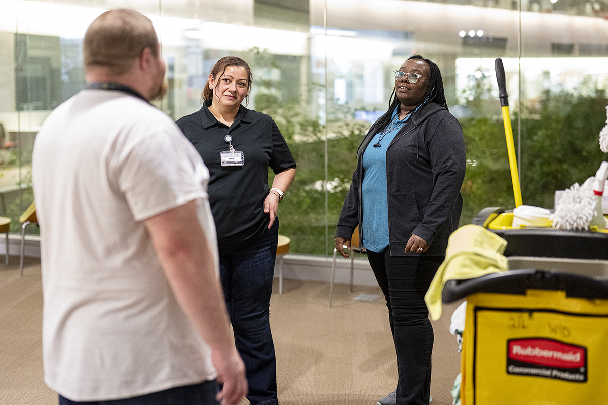 Martha Gonzalez and Ebonie Wilson-Brown converse with another person