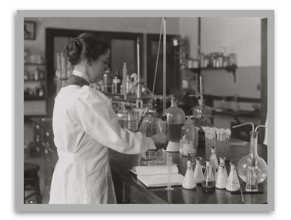 Black and white photo of Alice Evans in a laboratory