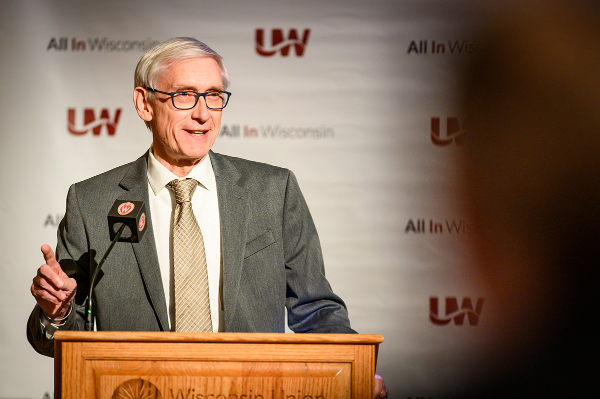 Wisconsin Governor, Tony Evers, speaks at a podium