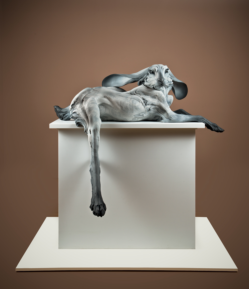 Beth Cavener's sculpture of a long-limbed rabbit resting languidly on a pedestal