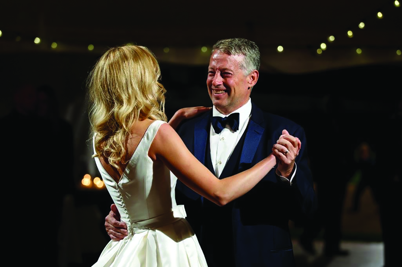 Michael Oglesby dances with his daughter at her wedding