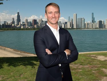 Portrait of Time Sanders in front of the Chicago skyline