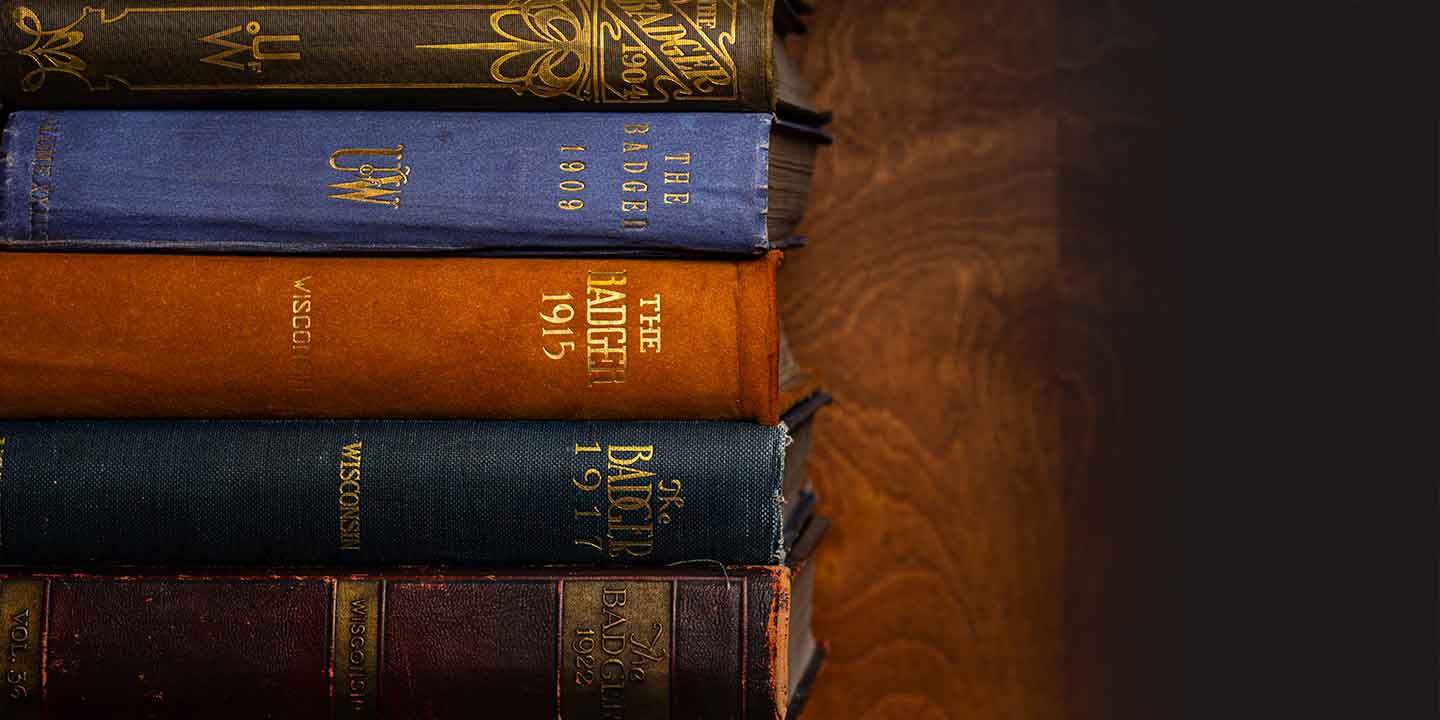 A stack of Badger Yearbooks from the early 1900s.