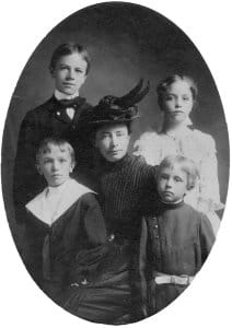 Aldo Leopold with his family in a black and white photograph.