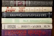 A stack of Badger Yearbooks from the 1900s.