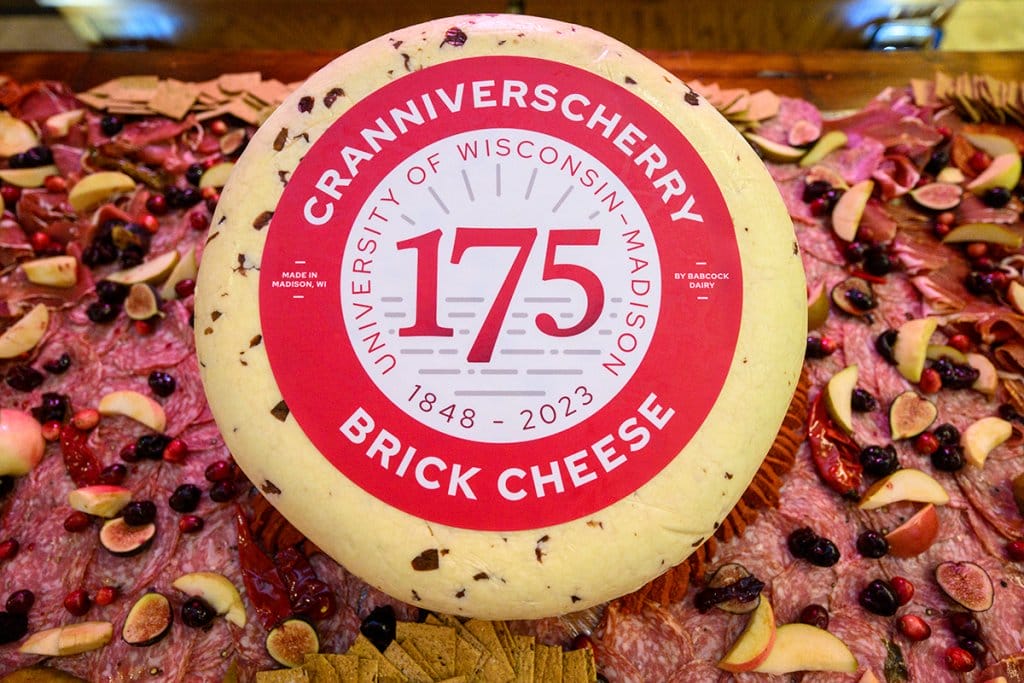 A brick cheese made by Babcock Dairy to celebrate Wisconsin's 175th anniversary called Cranniverscherry.