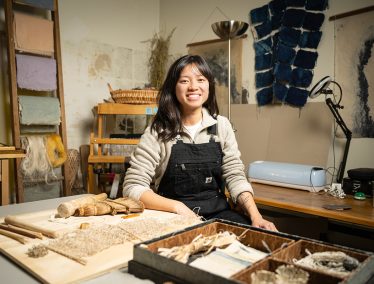 Portrait of Veronica Pham in a papermaking studio