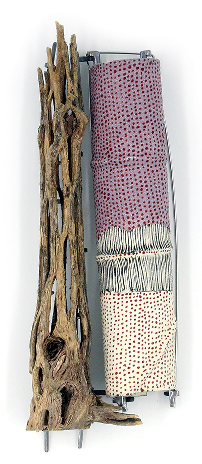 A brooch constructed of cholla bark, driftwood and enamel.