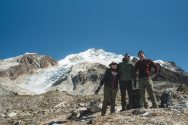 Yasmeen Orellana Salazar, Matias Romero, and Andy Jones pose in front of the Zongo Glacier