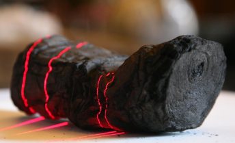 A lump of char in the vague shape of a scroll during the scanning process.