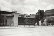 Black and white photo of the old University Square Building on campus, next to Vilas Hall.