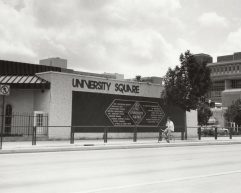 Black and white photo of the old University Square Building on campus, next to Vilas Hall.