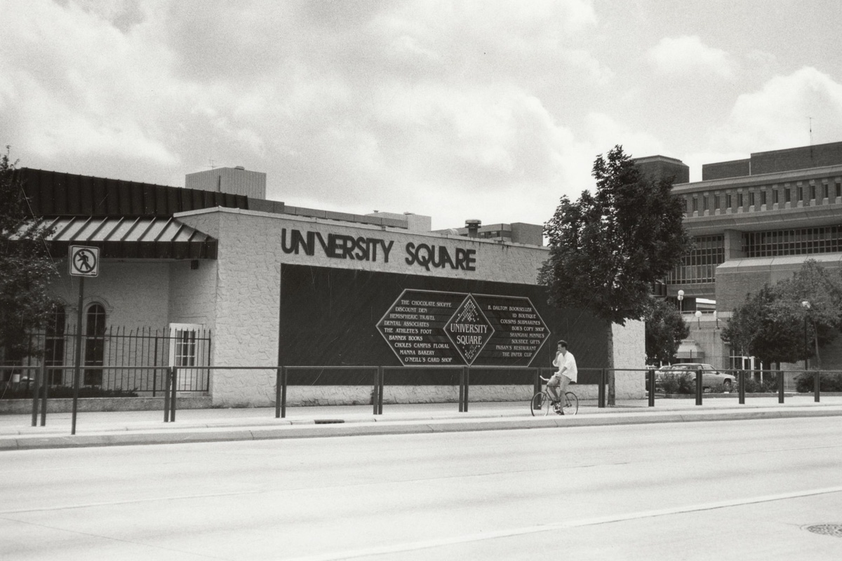 Black and white photo of the University Square Building on campus in the 1980s, next to Vilas Hall.