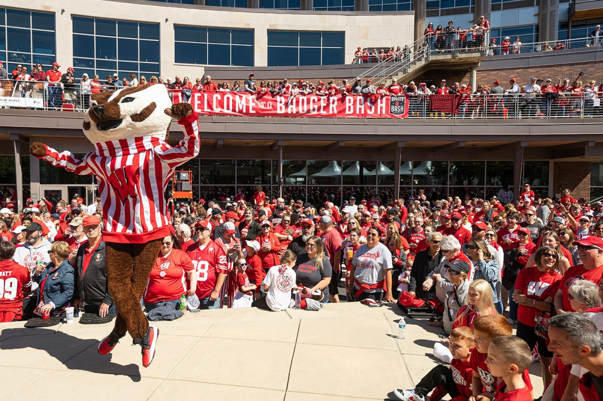Bucky Badger dances in front of a large crowd at Union South at the Badger Bash.