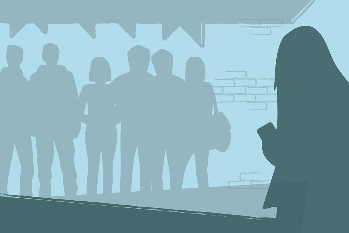 Illustration of silhouettes of people in the background with one person standing alone using a phone in the foreground.