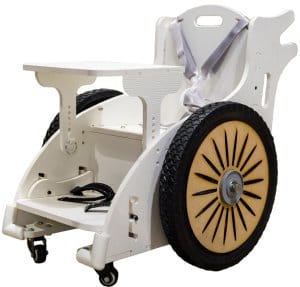 A small, custom-made wheelchair made from wood painted white and containing a harness, foot straps and extra big wheels.