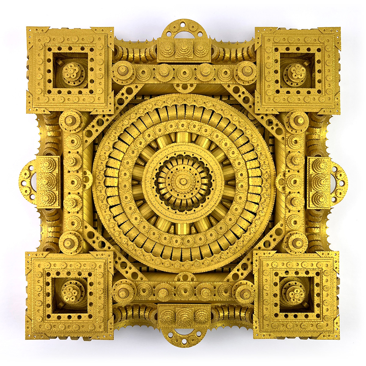 An intricate, symmetrical golden artwork made from paper, featuring a central circular pattern surrounded by detailed geometric shapes and ornate designs.