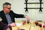 Kevin Zerman tests samples different beers in small glasses