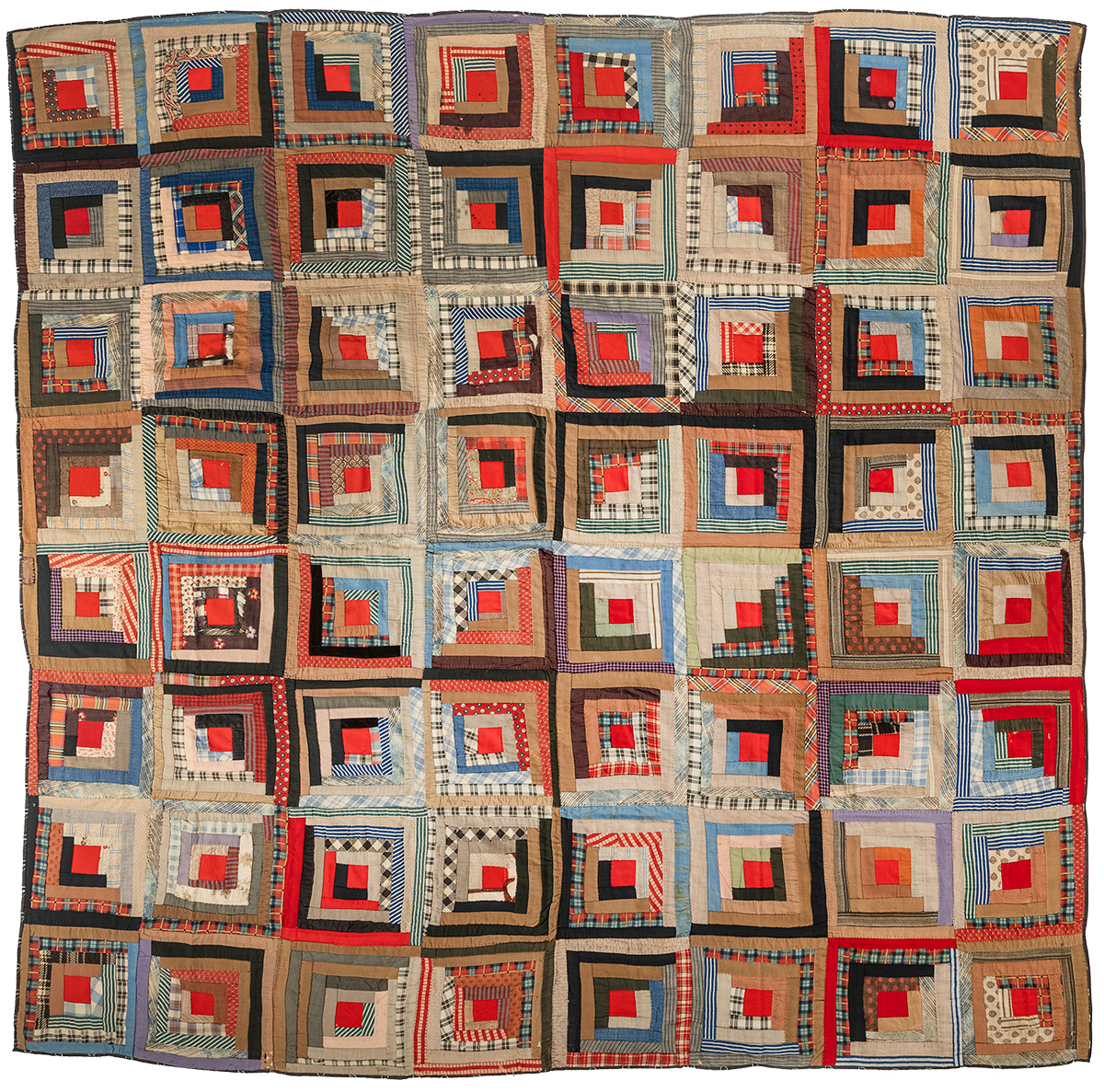 A patchwork quilt composed of square blocks, each featuring unique concentric patterns and vibrant colors.