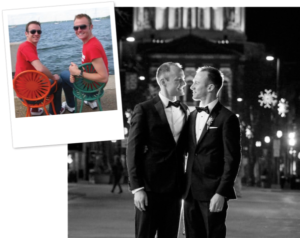 A couple in tuxedos stand close together on a city street at night with decorative lights and a large building in the background in a black and white photo, while an inset photo shows them sitting on terrace chairs by the waterfront wearing red shirts.